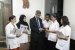 Dr. Vatsal Parikh in his chamber in discussions with staff