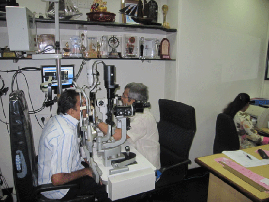 Dr. Vatsal Parikh examining camp patient
